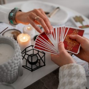 high-angle-woman-reading-tarot-home